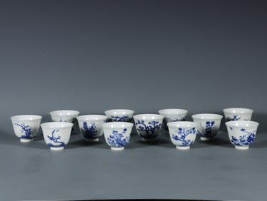 A set of blue and white twelve flower god cups from the Qing Dynasty