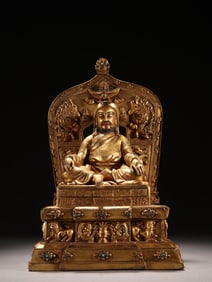 A bronze gilt statue of a god from the Qing Dynasty