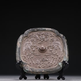 A Tang Dynasty inlaid sterling silver chisel double happiness pattern bronze mirror