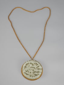 A sterling silver gilt jade dragon plaque