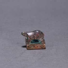 A bronze gold and silver turtle button seal from the Han Dynasty