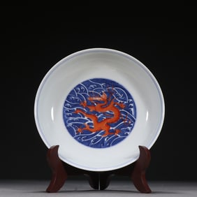 A blue and white alum red dragon pattern plate from the Qing Dynasty