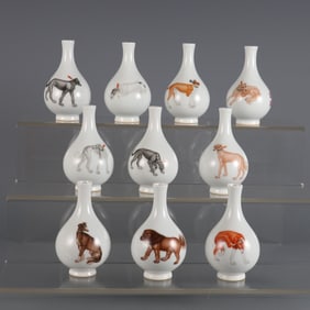 A set of enamel painted ten dog figure snuff bottles from the Qing Dynasty