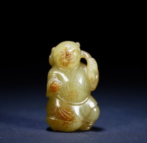 A piece of topaz red holding a lotus boy