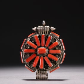 A silver-inlaid coral Karma black box