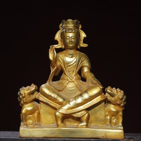 A bronze gilt statue of the Great Day Rogue Buddha