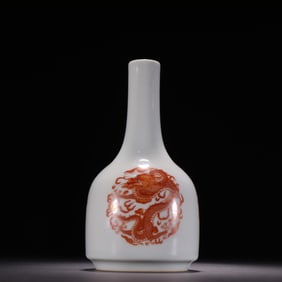 A bottle with a red alum depiction of gold dragon play beads