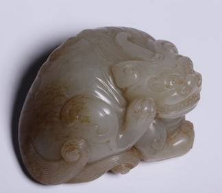 A treasure of Hetian jade seed material raw skin Qinrui beast