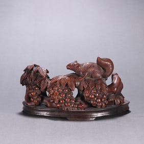 A Qing Dynasty bamboo carved squirrel grape ornament