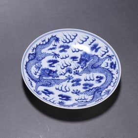 A blue and white double dragon play bead plate from the Qing Dynasty