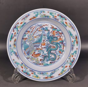A piece of blue and white bucket color dragon and phoenix in the Qing Dynasty is an auspicious plate