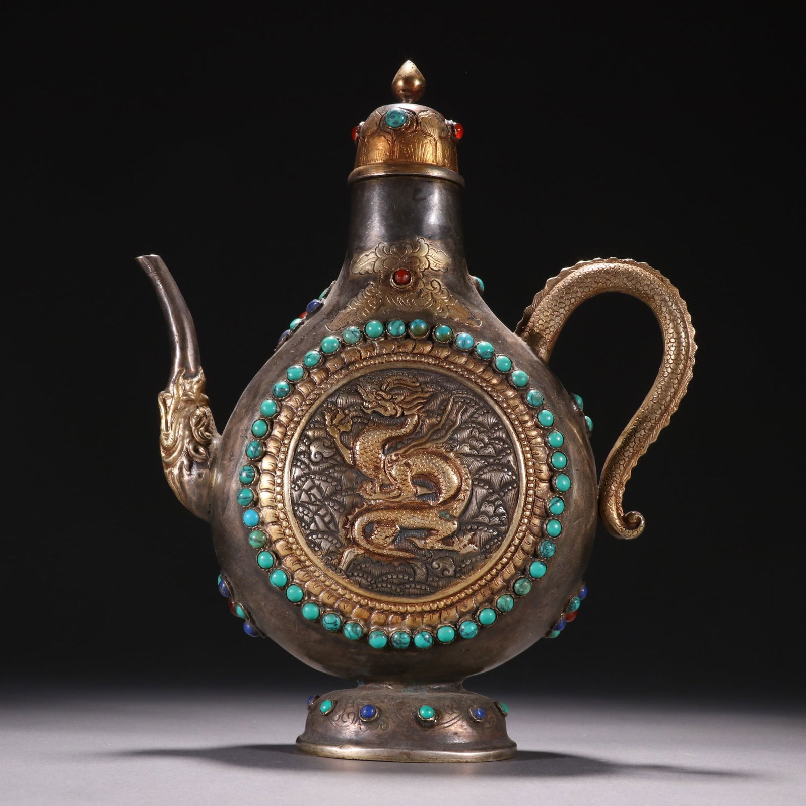 A Tang silver-gilt gem-encrusted dragon and phoenix flask: Tang silver gilt inlaid gemstone dragon and phoenix pattern wine jug Size:H:12cm W:17.7cm W:650g (The Dimensions Of All Batches Are Manually Measured.If You Need More Detailed Information, Please Cont