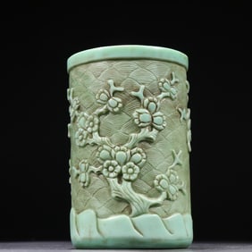 A glazed carved pine plum blossom pattern pen holder from the Qing Dynasty