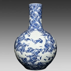 A blue and white relief seawater dragon pattern celestial ball bottle made in the Yongzheng year of