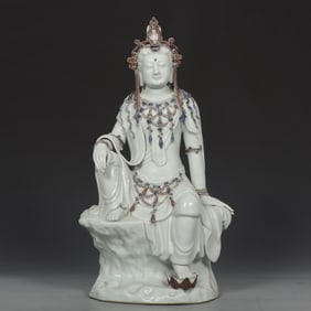 A blue and white glaze red lotus of the Yuan Dynasty sitting statue