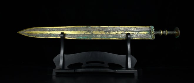 A bronze and gold and silver inlaid turquoise bamboo sword of the Warring States period