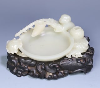 A late Qing Dynasty Hetian figure boy fishing wash original with rosewood bottom tray