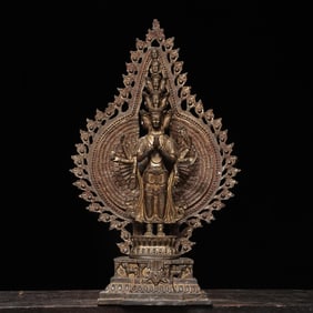 A bronze and gold statue of the thousand-armed Guanyin Buddha