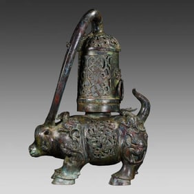A bronze hollowed-out cow lantern from the Warring States period