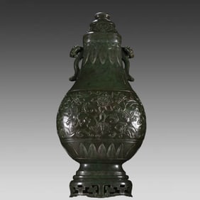 A Hetian Jasper Buddha Eight Treasures Ruyi amphora from the Qing Dynasty
