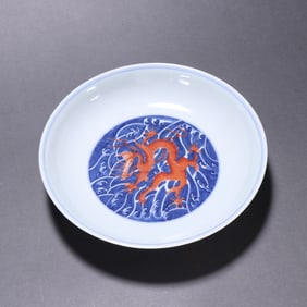 A blue and white alum red dragon pattern plate from the Qing Dynasty