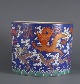 A Qing Dynasty blue ground pastel nine-dragon pattern pen holder