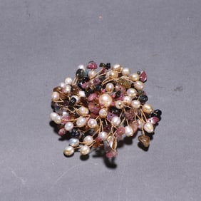 A piece of pearl tourmaline jewelry