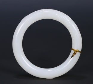 A Qing dynasty Hetian white jade lotus magpie round bar bracelet