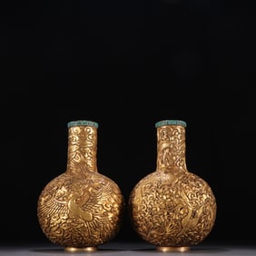 A pair of Qing Dynasty bronze gilt dragon and phoenix pattern celestial globe bottles