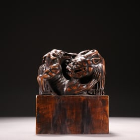 A sandalwood beast button seal from the Qing Dynasty
