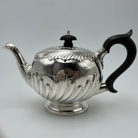 A small British sterling silver teapot