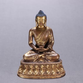 A gilded bronze statue of Shakyamuni Buddha