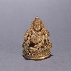 A Qing Dynasty bronze gilt statue of the God of Wealth Buddha