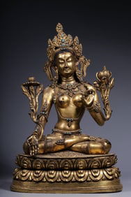 A bronze gilt inlaid turquoise white Tara seated statue from the Qing Dynasty