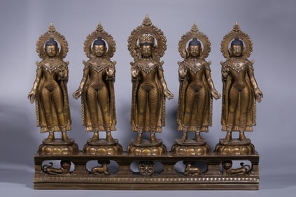 A Qing Dynasty alloy copper inlaid silver five-sided Buddha standing statue