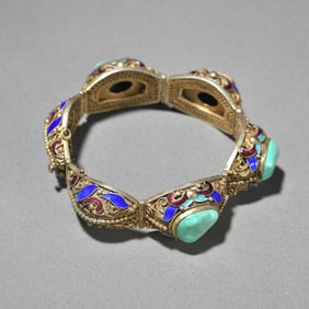 A silver-gilt turquoise hand row