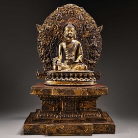A bronze statue engraved in high relief with lacquered gold Tibetan Medicine Buddha