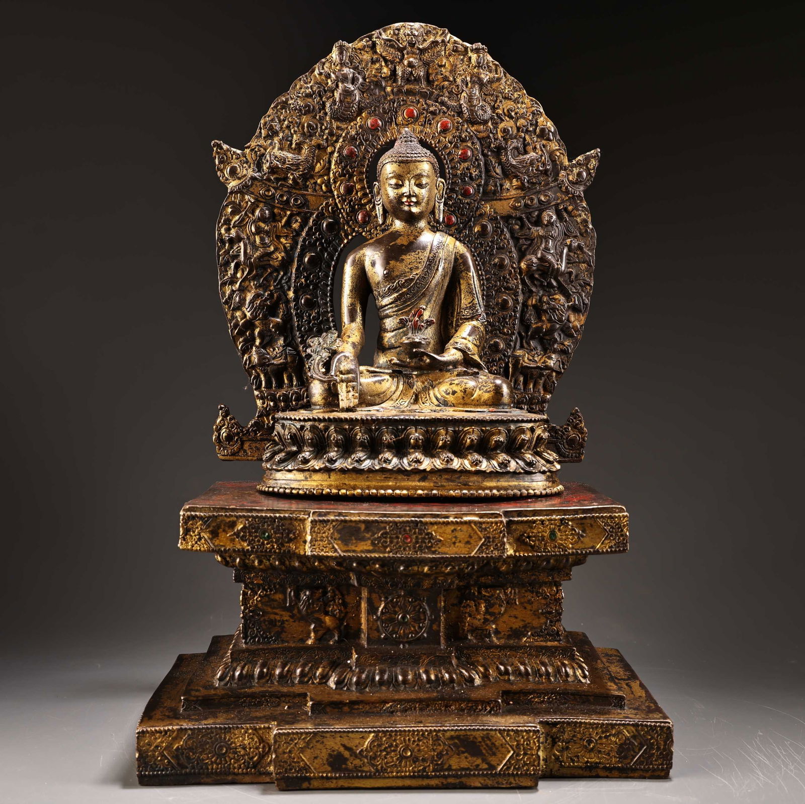 A bronze statue engraved in high relief with lacquered gold Tibetan Medicine Buddha (1 of 9)