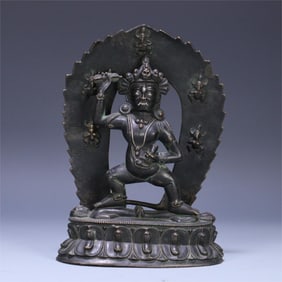 A bronze and silver statue of Vajrapani