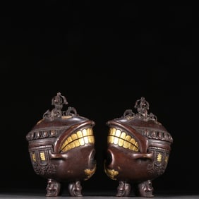 A pair of gilt copper-gilt human skull cover boxes