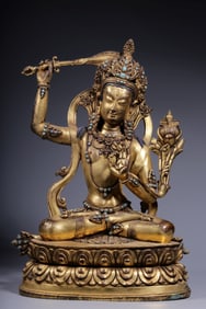 A bronze gilt inlaid turquoise statue of Manjushri from the Qing Dynasty