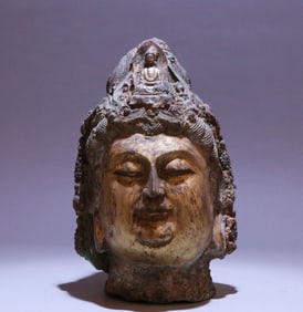 A bronze gilt Buddha head