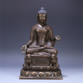 A statue of Shakyamuni in Swat style with gold and bronze inlaid with silver