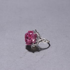 A silver ruby pattern ring