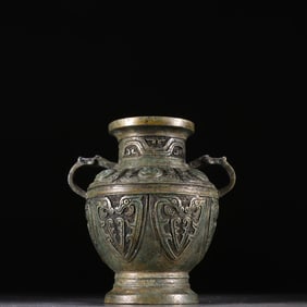 A bronze lotus petal dragon ear pot