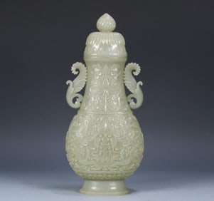 A Qing Dynasty rosewood box and Tian jade entwined branches floral pattern appreciation bottle