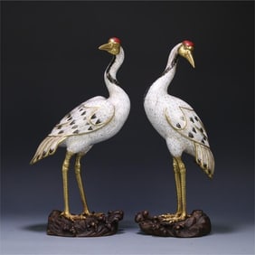 A pair of bronze cloisonne crane ornaments from the Qing Dynasty