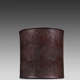 A piece of rosewood inlaid with silver silk animal face back pattern pen holder