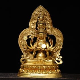 A bronze gilt painted statue of a thousand-armed Guanyin Buddha