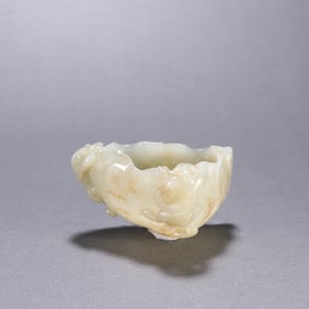 A piece of Hetian jade seed material of the Qing Dynasty dragon lotus leaf pen wash